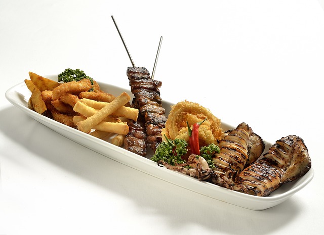 platter of barbecued meat and french fries