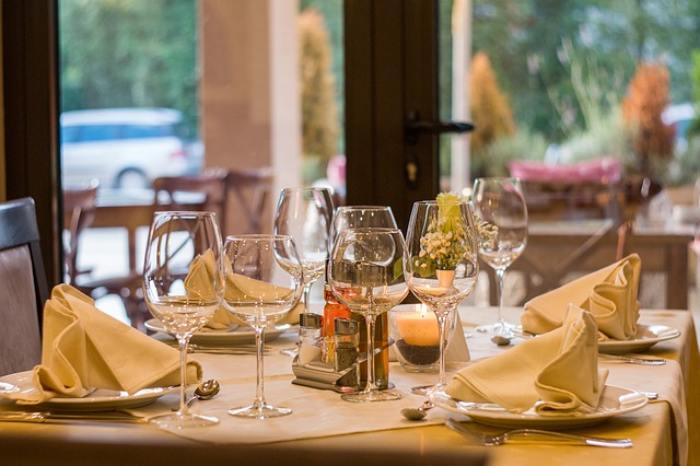 beautiful restaurant table setting with wine glasses