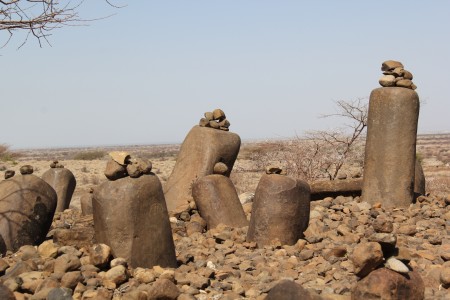 Cluster of cylindrical stone pillars with little rocks on top