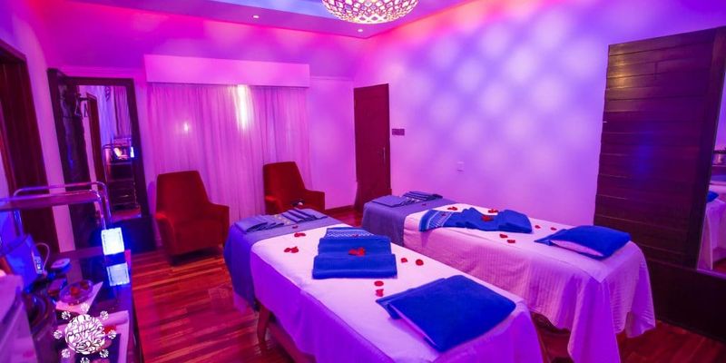 twin spa beds in a purple room