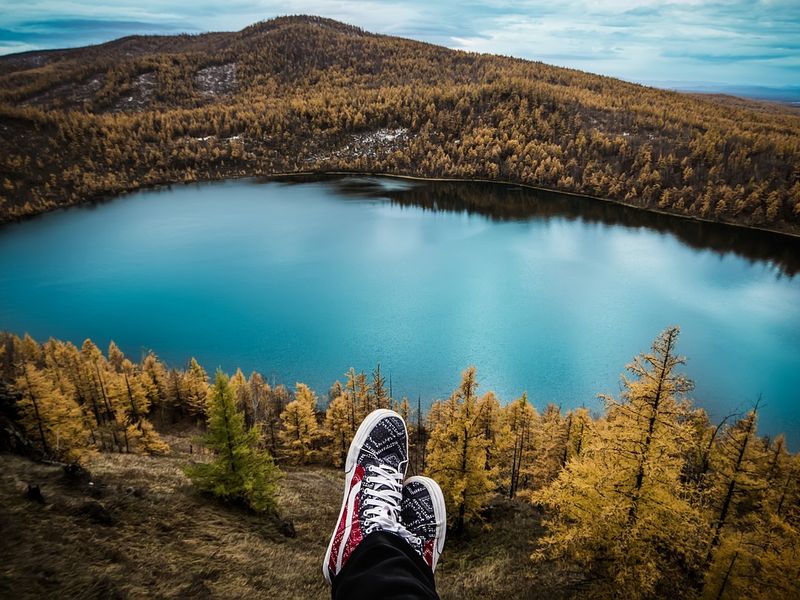 Solo traveler overlooking a lake