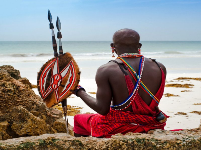 Maasai Warrior staring into the sea