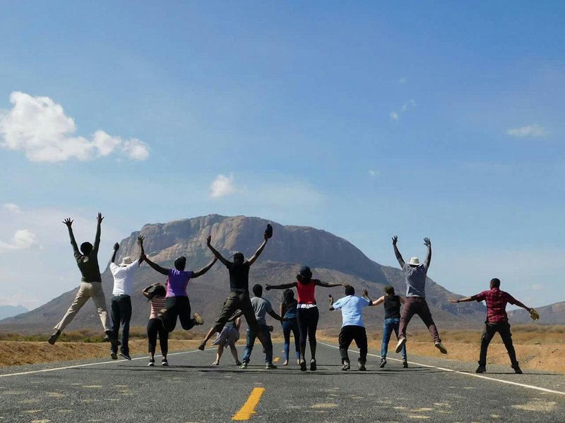 Group of friends with Mt. Ololokwe in the background