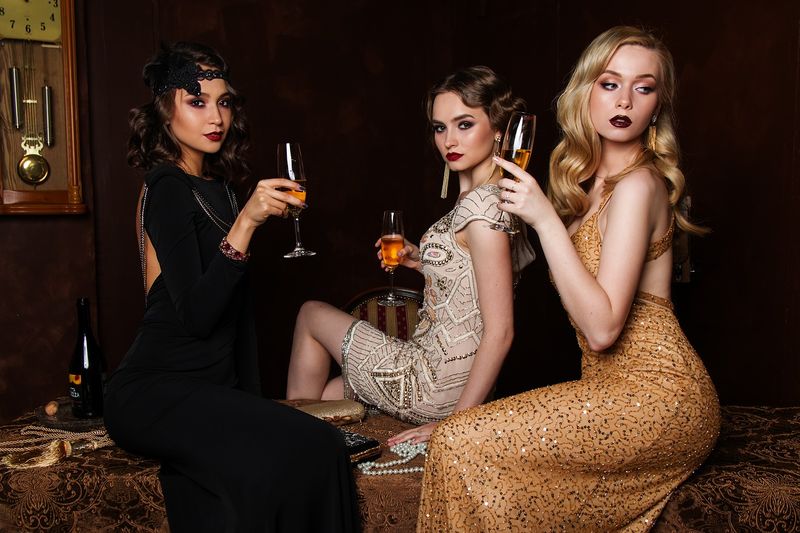Three women dressed as Bond Girls