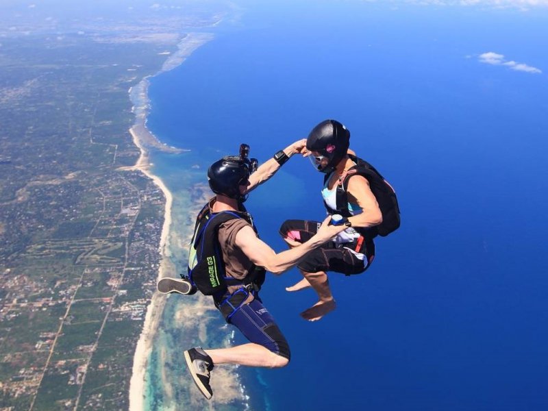 skydivers over Diani